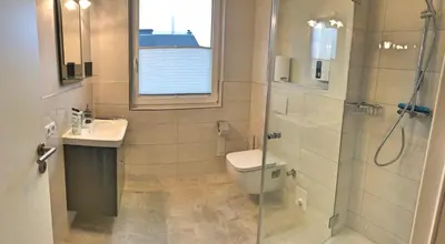 Ein Badezimmer in der Unterkunft Appartementhaus Zur Sonne - Whg. F