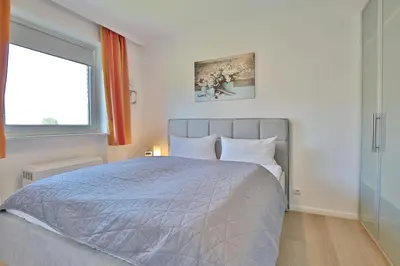 Ein Bett oder Betten in einem Zimmer der Unterkunft WEG Waldblick Appartement 16