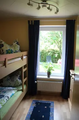 Ein Bett oder Betten in einem Zimmer der Unterkunft Ferienhaus Dorit & Rüdiger Fahl