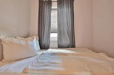 Ein Bett oder Betten in einem Zimmer der Unterkunft Alte Post Strandmuschel Appartement 3