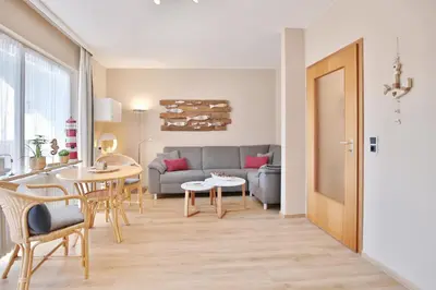Ein Sitzbereich in der Unterkunft Ferienhaus Dornkampstraße 1 Ostseewelle Appartement 5