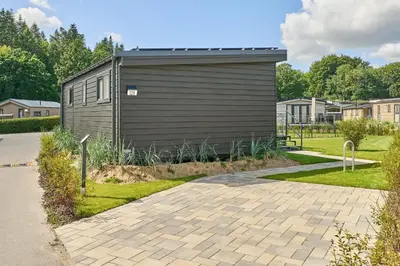 Ein Garten an der Unterkunft Ostseecamp Ferienhaus 