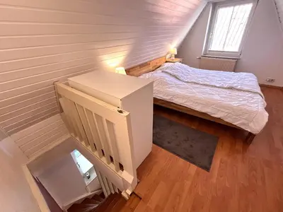 Ein Bett oder Betten in einem Zimmer der Unterkunft Idyllisches Ganghaus - Altstadt Lübeck