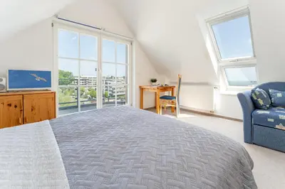 Ein Bett oder Betten in einem Zimmer der Unterkunft Nimm dir Zeit für Meer