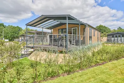 Ein Garten an der Unterkunft Ostseecamp Ferienhaus 