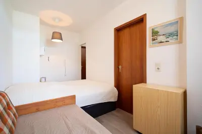 Ein Bett oder Betten in einem Zimmer der Unterkunft Berliner Hof App 303