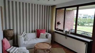 Ein Sitzbereich in der Unterkunft Relax with a pool and sauna in Trave Kieker 005!
