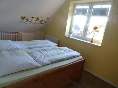 Ein Bett oder Betten in einem Zimmer der Unterkunft Niendorf Ostsee Ferienwohnung
