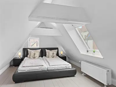 Ein Bett oder Betten in einem Zimmer der Unterkunft Objekt-Nr 161 - Hafen - Vorderreihe