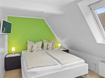 Ein Bett oder Betten in einem Zimmer der Unterkunft Objekt-Nr 161 - Hafen - Vorderreihe