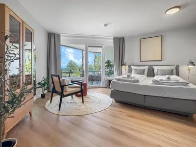 Ein Bett oder Betten in einem Zimmer der Unterkunft Design-Apartment mit Meerblick