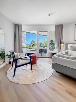 Ein Bett oder Betten in einem Zimmer der Unterkunft Design-Apartment mit Meerblick