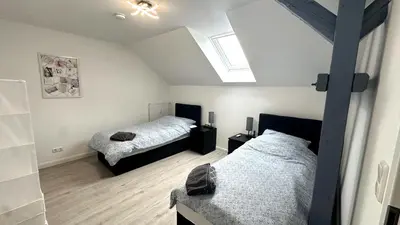 Ein Bett oder Betten in einem Zimmer der Unterkunft Loft9 Architektenwohnung mit Dachterrasse Zentral