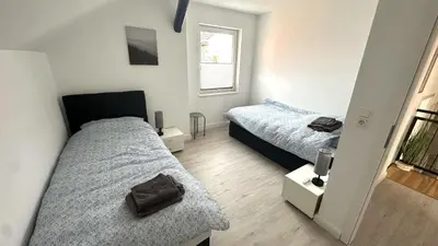 Ein Bett oder Betten in einem Zimmer der Unterkunft Loft9 Architektenwohnung mit Dachterrasse Zentral