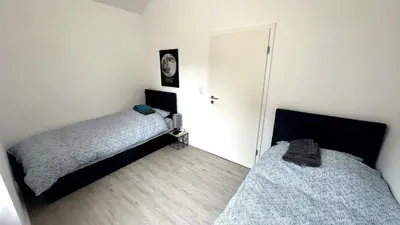 Ein Bett oder Betten in einem Zimmer der Unterkunft Loft9 Architektenwohnung mit Dachterrasse Zentral
