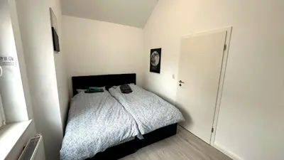 Ein Bett oder Betten in einem Zimmer der Unterkunft Loft9 Architektenwohnung mit Dachterrasse Zentral