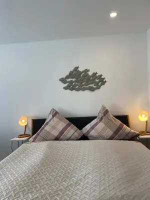 Ein Bett oder Betten in einem Zimmer der Unterkunft MeerZeit mit Schwimmbad und Sauna