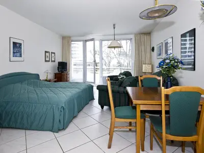Ein Bett oder Betten in einem Zimmer der Unterkunft Ferienwohnungen im Hotel Royal