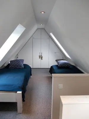 Ein Bett oder Betten in einem Zimmer der Unterkunft Möwennest und Fischerstuv