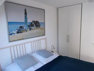 Ein Bett oder Betten in einem Zimmer der Unterkunft Möwennest und Fischerstuv