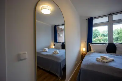 Ein Bett oder Betten in einem Zimmer der Unterkunft HejU - Gemütliche Auszeit am Meer