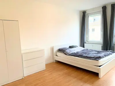 Ein Bett oder Betten in einem Zimmer der Unterkunft Stilvolle Wohnung mit Balkon Perfekt für Städtetrip Lübeck