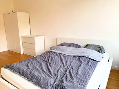 Ein Bett oder Betten in einem Zimmer der Unterkunft Stilvolle Wohnung mit Balkon Perfekt für Städtetrip Lübeck