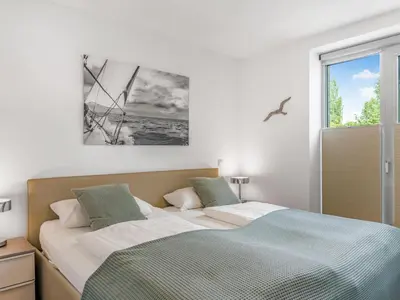 Ein Bett oder Betten in einem Zimmer der Unterkunft Objekt-Nr 28 - Ort - Europaweg