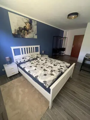 Ein Bett oder Betten in einem Zimmer der Unterkunft GartenOase Lübeck