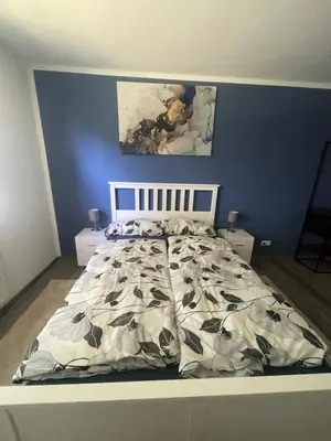 Ein Bett oder Betten in einem Zimmer der Unterkunft GartenOase Lübeck