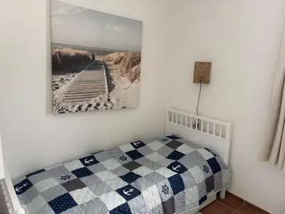 Ein Bett oder Betten in einem Zimmer der Unterkunft Strandperle