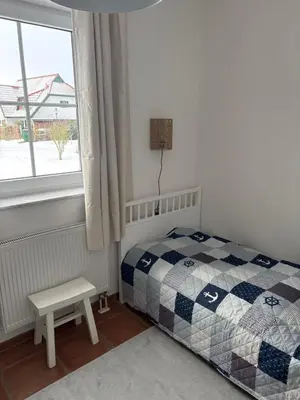 Ein Bett oder Betten in einem Zimmer der Unterkunft Strandperle