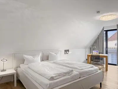 Ein Bett oder Betten in einem Zimmer der Unterkunft Objekt-Nr 132 - Hafen - Kurgartenstraße