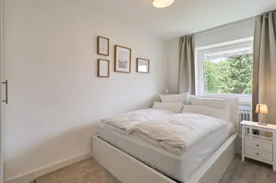 Ein Bett oder Betten in einem Zimmer der Unterkunft Sonnennest Scharbeutz