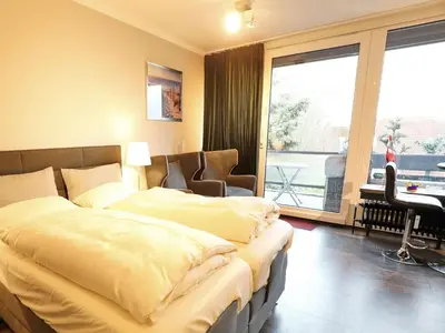 Ein Bett oder Betten in einem Zimmer der Unterkunft Achterdeck, Fewo 202