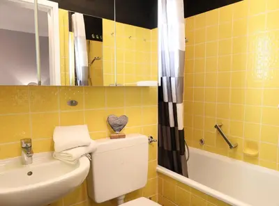 Ein Badezimmer in der Unterkunft Achterdeck, Fewo 202
