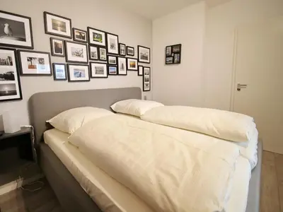 Ein Bett oder Betten in einem Zimmer der Unterkunft Achterdeck, Fewo 203