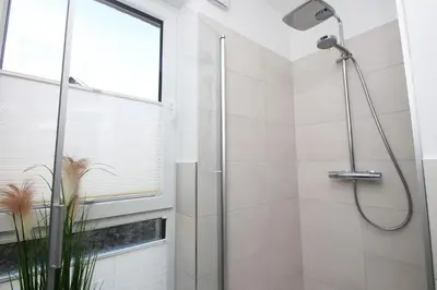 Ein Badezimmer in der Unterkunft Dünenhaus Steuerbord, Fewo 112