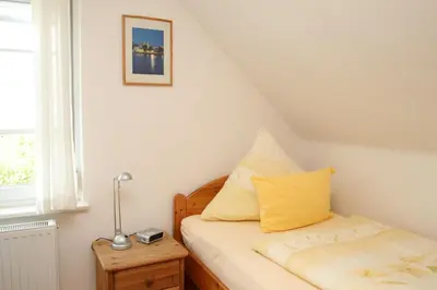 Ein Bett oder Betten in einem Zimmer der Unterkunft Alfred-Hagelstein-Straße, Fewo 159