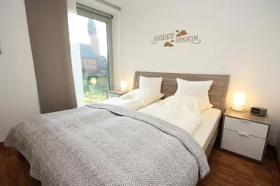 Ein Bett oder Betten in einem Zimmer der Unterkunft Europaweg, Fewo 131