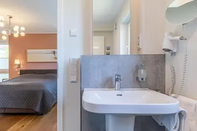 Ein Bett oder Betten in einem Zimmer der Unterkunft Dünenhaus Steuerbord, Fewo 138