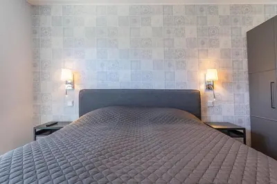 Ein Bett oder Betten in einem Zimmer der Unterkunft Dünenhaus Steuerbord, Fewo 138