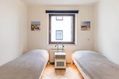 Ein Bett oder Betten in einem Zimmer der Unterkunft Fallreep, Fewo 148