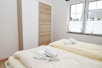 Ein Bett oder Betten in einem Zimmer der Unterkunft Haus Aaron Fehlingstraße, Fewo 224