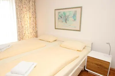 Ein Bett oder Betten in einem Zimmer der Unterkunft Kaiserallee, Fewo 168