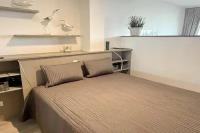 Ein Bett oder Betten in einem Zimmer der Unterkunft Kaiserallee, Fewo 144