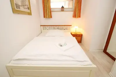 Ein Bett oder Betten in einem Zimmer der Unterkunft Kaiserallee, Fewo 160