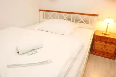 Ein Bett oder Betten in einem Zimmer der Unterkunft Kaiserallee, Fewo 160
