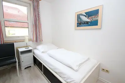 Ein Bett oder Betten in einem Zimmer der Unterkunft Kaiserallee, Fewo 160