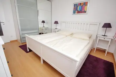 Ein Bett oder Betten in einem Zimmer der Unterkunft Kaiserallee, Fewo 134